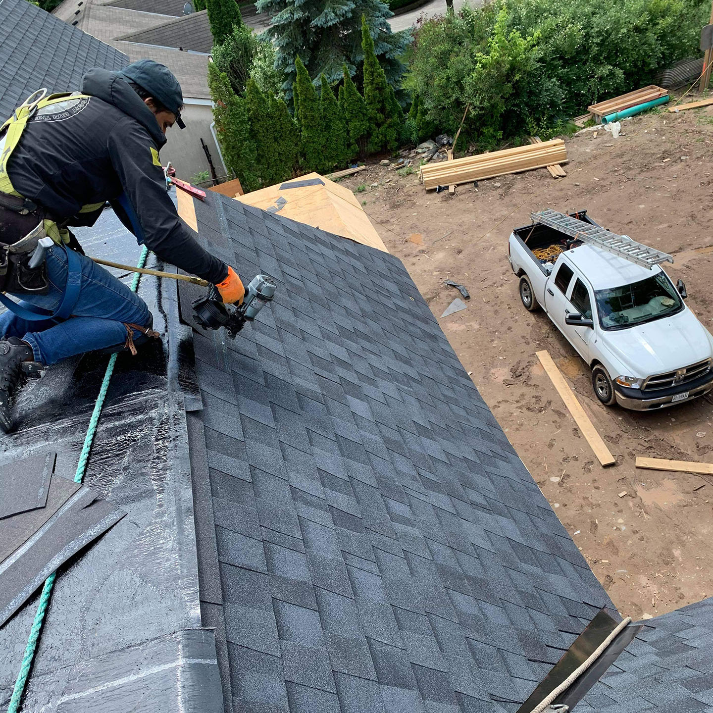 a man from ulises roofing installing a roof in the GTA